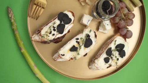 Gourmet Toasts with Black Truffle on Gold Tray