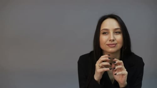 Smiling Woman with Long Hair and Hoop Earrings