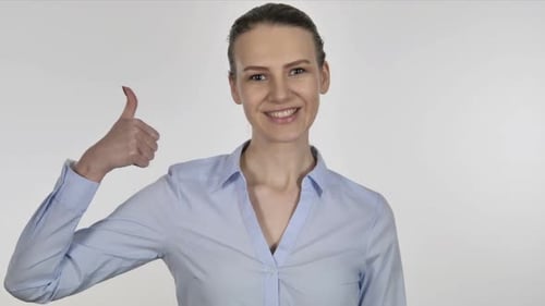 Woman Smiling and Giving a Thumbs Up