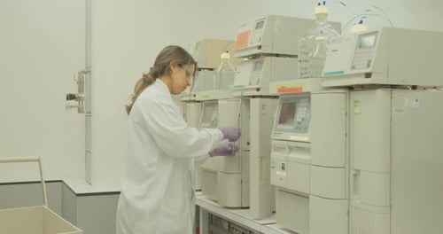 Adult Works with Lab Equipment in Laboratory