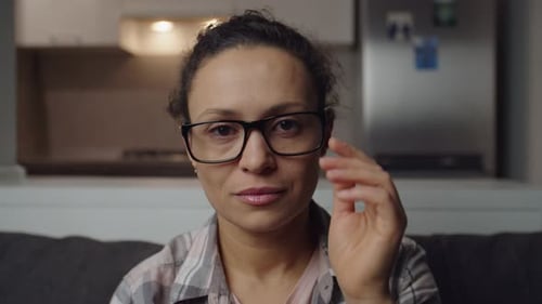 Woman with Glasses Smiling Indoors at Home