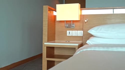 Modern Hotel Bedroom Interior with Bed and Lamp