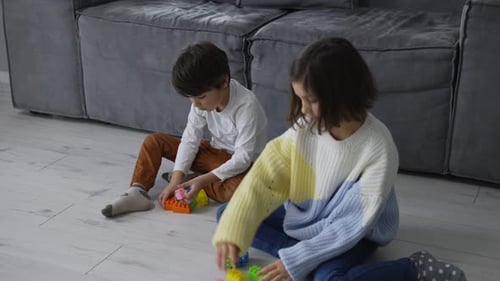 Kids Playing with Building Blocks at Home