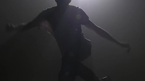 Silhouette Young Man Dancing Single in Club, Neon Light, Lots of Smoke. Fashion Street Wear