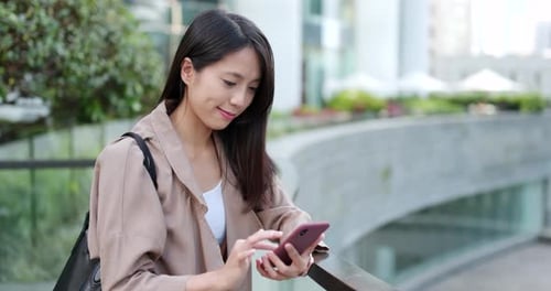 Woman use of cellphone at outdoor