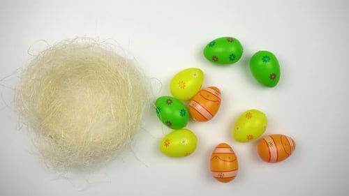 Colorful Easter Eggs Placed in Decorative Nest