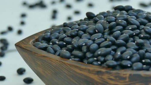 Close Up of Black Beans in Wooden Bowl