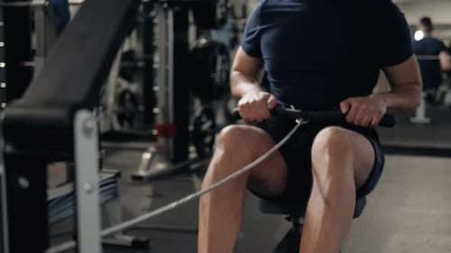 Close Up Photo of Beautiful Man Training on Fitnessstation