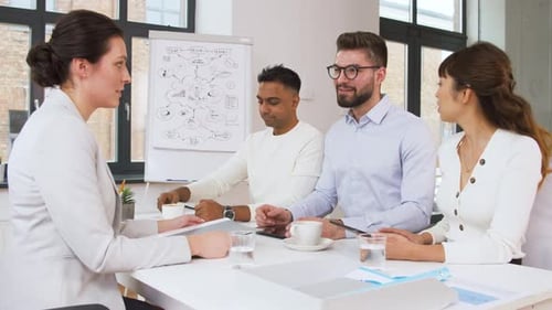 Diverse Team Collaborating in Bright Office Meeting