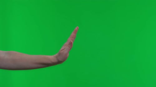Woman Hand Show Stop Sign Isolated On Green Screen Background