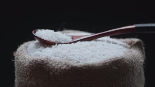 Close Up Burlap Sack Filled with White Rice