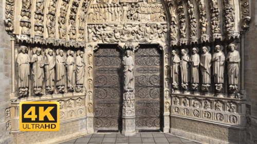 Intricate Cathedral Archway with Religious Sculptures and Carvings