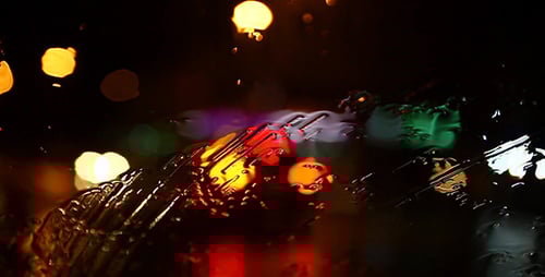 Rain Streaks on Glass at Night