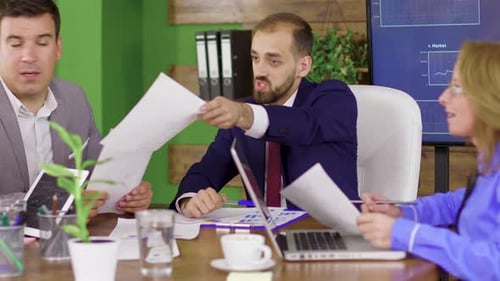 Team Discussing Data in Modern Urban Office