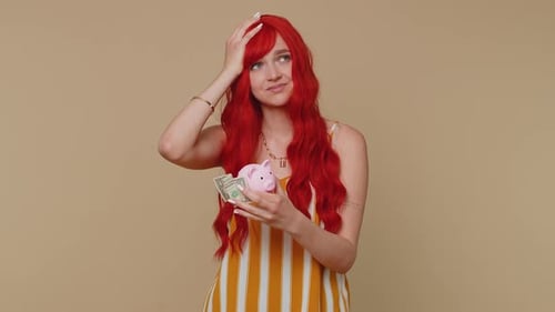 Poor Girl Upset Over Insufficient Amount of Money Holding Piggybank One Dollar Banknote Bankruptcy