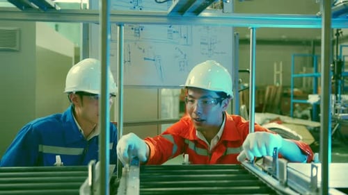 Male Asian engineer professional having a discussion