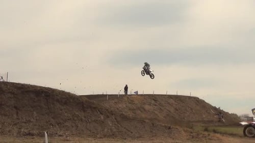 Motocross Riders Jumping on a Dirt Bike Course