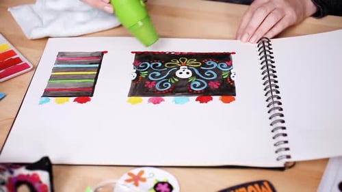 Artist Drying Day of the Dead Inspired Artwork