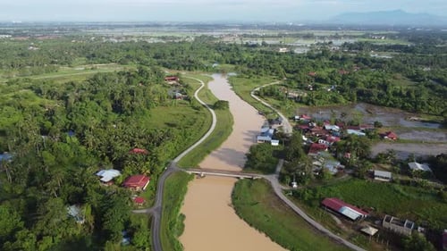 Aerial move over river surrounding by green environment
