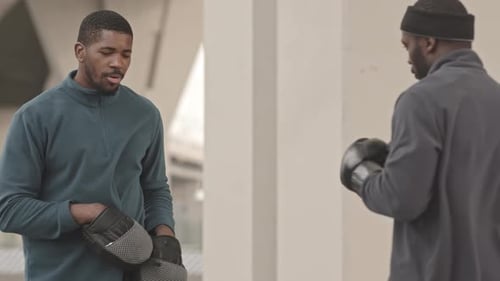 Two African-American Men at Outdoor Boxing Training