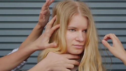 Blonde Woman Having Hair Styled