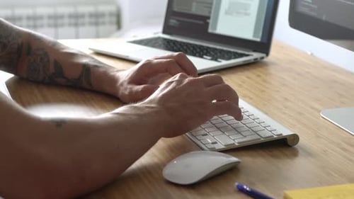 Graphic Designer At Wood Desk