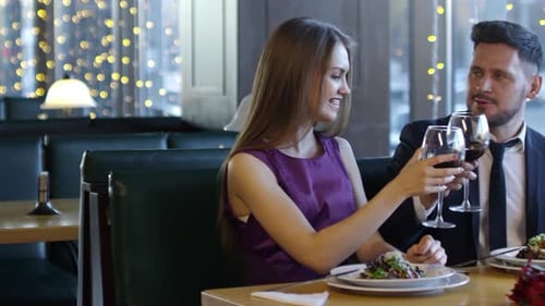 Man and Woman Drinking Wine on Date