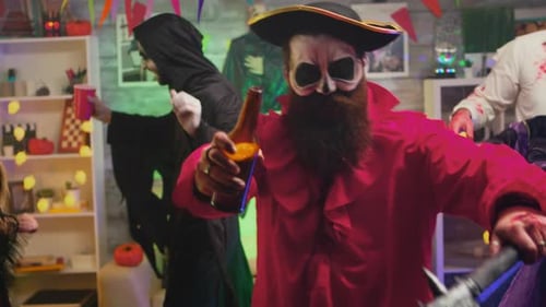 Costumed Partygoers Celebrate Halloween Indoors at a Party