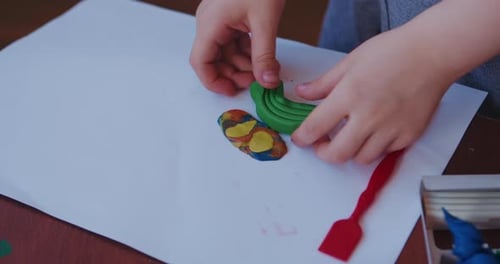 Child Creates Colorful Clay Art at Home
