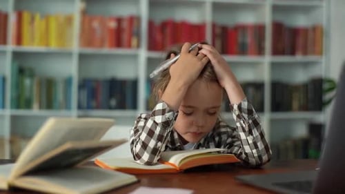 Closeup Portrait of Exhausted Sad Primary Child School Girl Studying Feeling Headache Writing