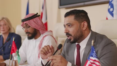 People Speaking at an International Diplomatic Meeting