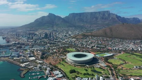 Wide Aerial Shot Tracking Forward Into the City of Cape Town During a Spectacular Sunrise with Table