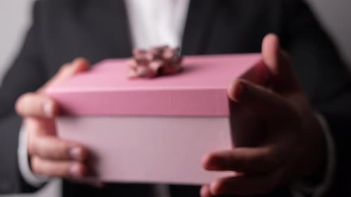 Presenting Pink Gift Box With Bow and Ribbon