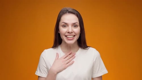 Portrait of Woman Shocked and Surprised with Good News