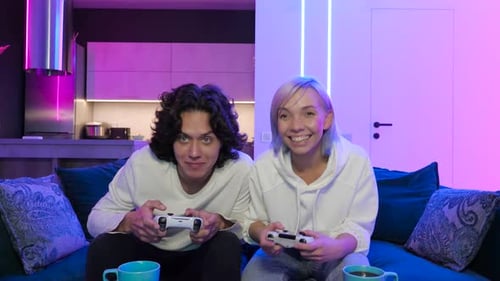 Friends Play Video Games Together in Modern Home