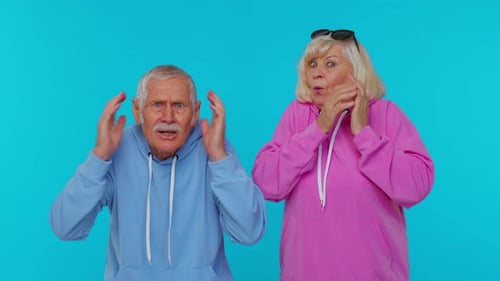 Senior Couple Reacts with Surprise and Excitement