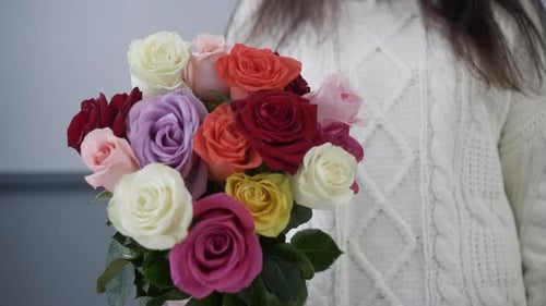 Close Up Bouquet From Colorful Roses in Female Hand
