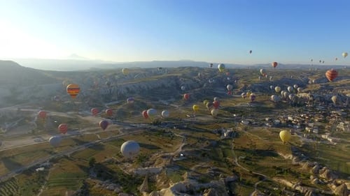 Aerial View of Hot Air Balloons Over Landscape