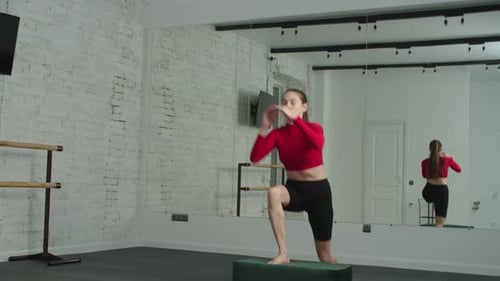Sporty Fitness Woman Doing Box Step Up Exercise at Gym