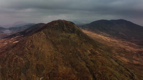 Killarney, Kerry, Ireland, March 2022. Drone tracks northwest above Molls Gap under a moody sky with