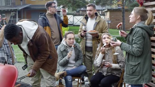 Friends Enjoy Backyard Barbecue on Sunny Day