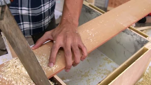 Carpenter Working on Wood Craft at Workshop