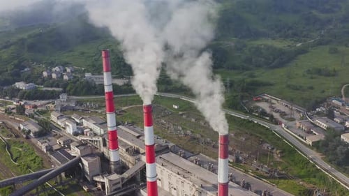 Aerial View of the Pipes of a Coal Power Plant and Cooling Tower