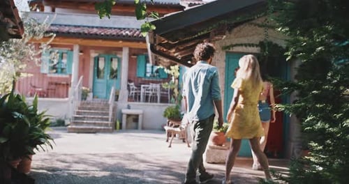 Friends walk through doorway