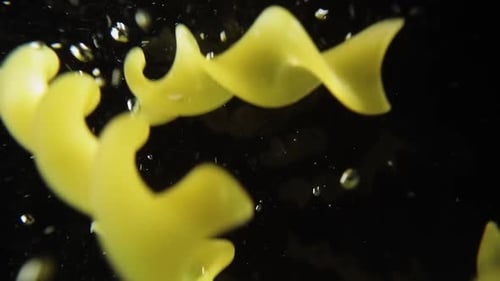 Fusilli Pasta Falling into Water