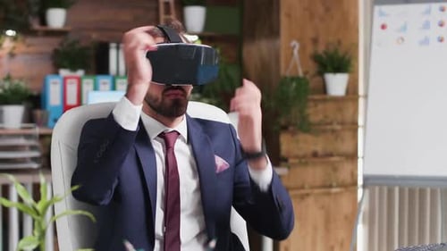 Man in Suit Wearing VR Headset in Office