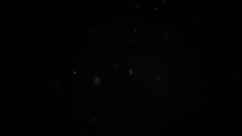 Abstract Dust Particles Against Black Background
