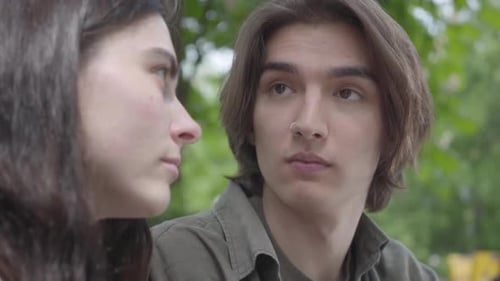 Portrait Adorable Young Couple in Casual Clothes Spending Time Together in the Park, Having a Date