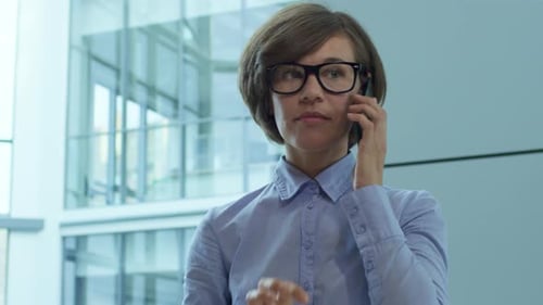 Pretty Business Lady Answering Call on Mobile Phone