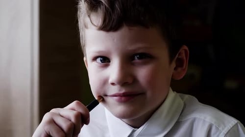 CU: Portrait of a Boy Who Is Preparing To Go To School, He Smiles.